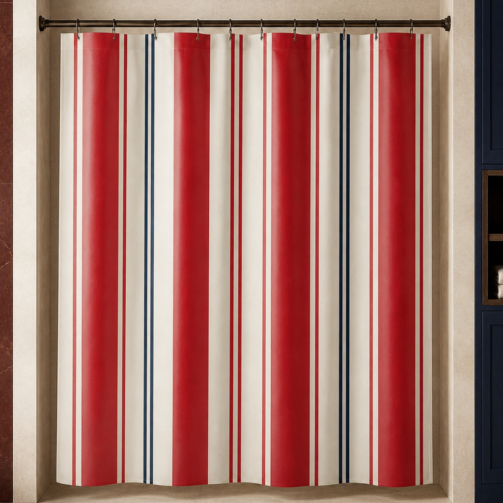 Regatta red, navy and ivory striped shower curtain in a luxury travertine bathroom with oxblood stone and navy cabinetry
