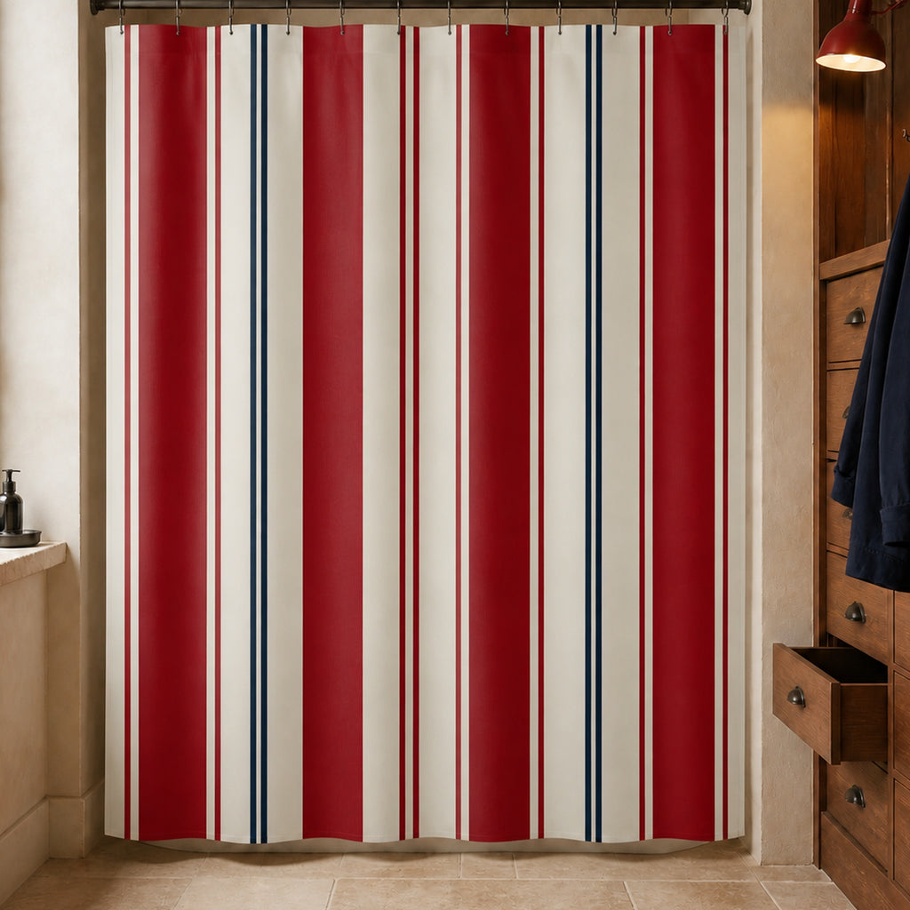 Regatta red, navy and ivory striped shower curtain in a harbor loft bathroom with teak drawers, navy jacket and red lamp