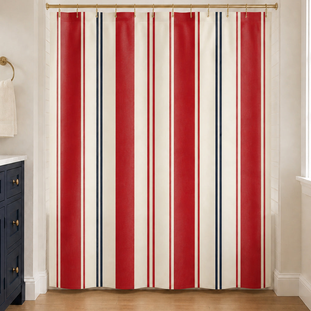 Regatta red, navy and ivory striped shower curtain in a warm white guest bathroom with navy vanity