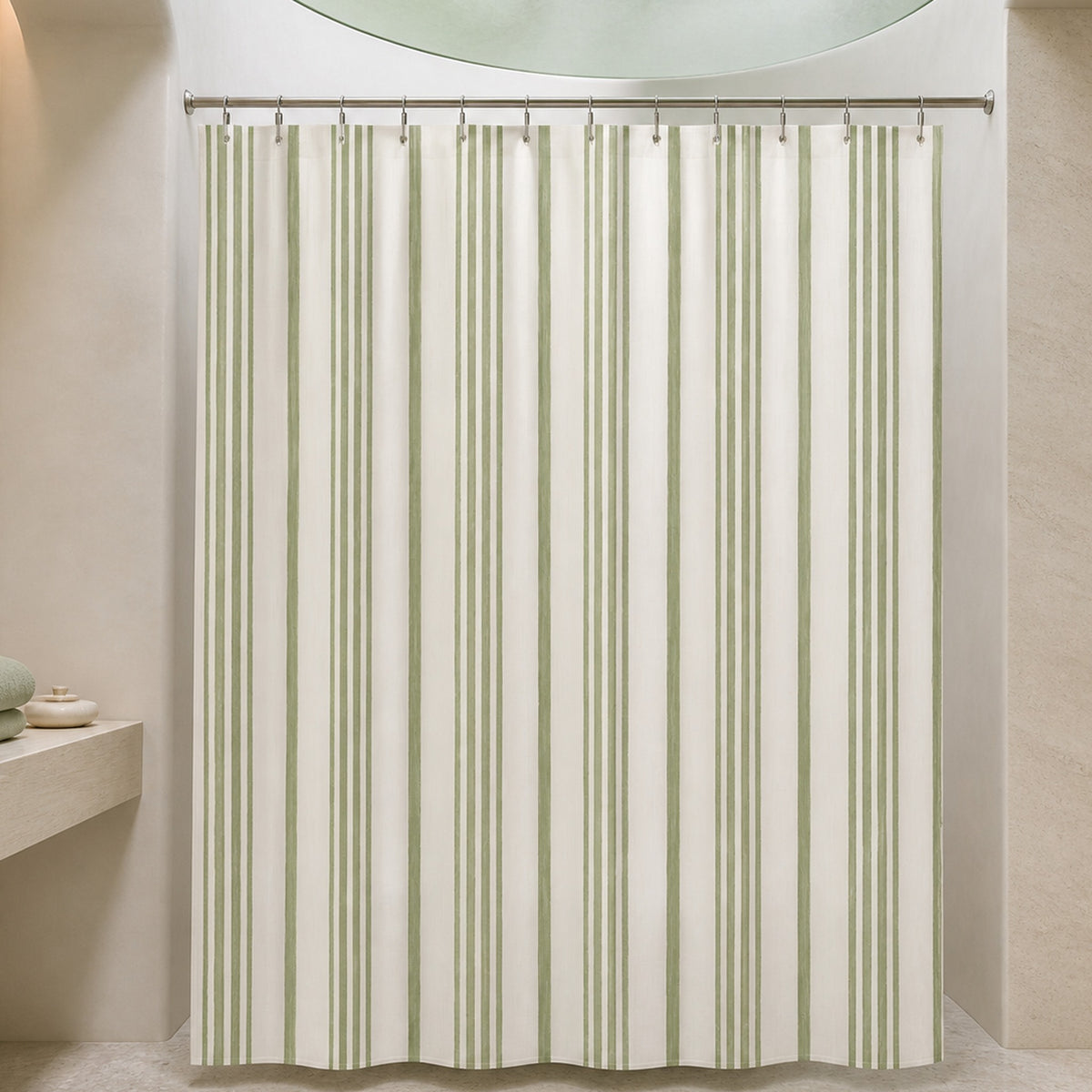 Sage ticking stripe shower curtain in a curved plaster and celadon glass designer bathroom