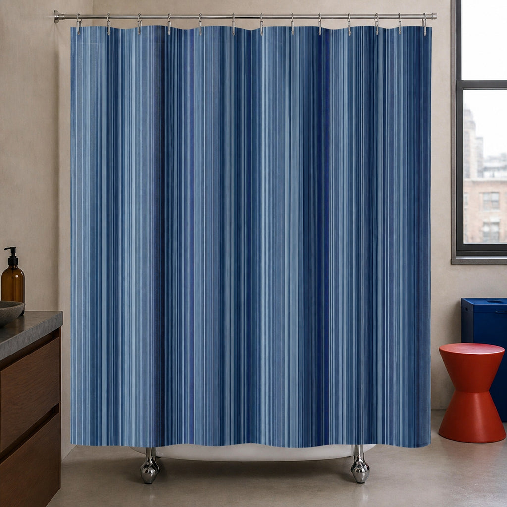 Navy slate dense pinstripe shower curtain in an urban bathroom with walnut and vermilion