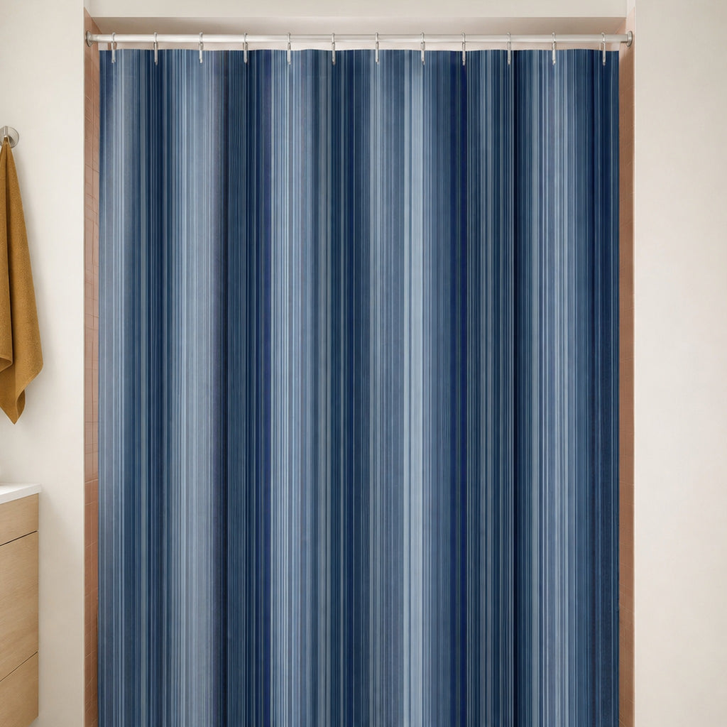 Navy slate dense pinstripe shower curtain in a warm white bathroom with clay pink tile