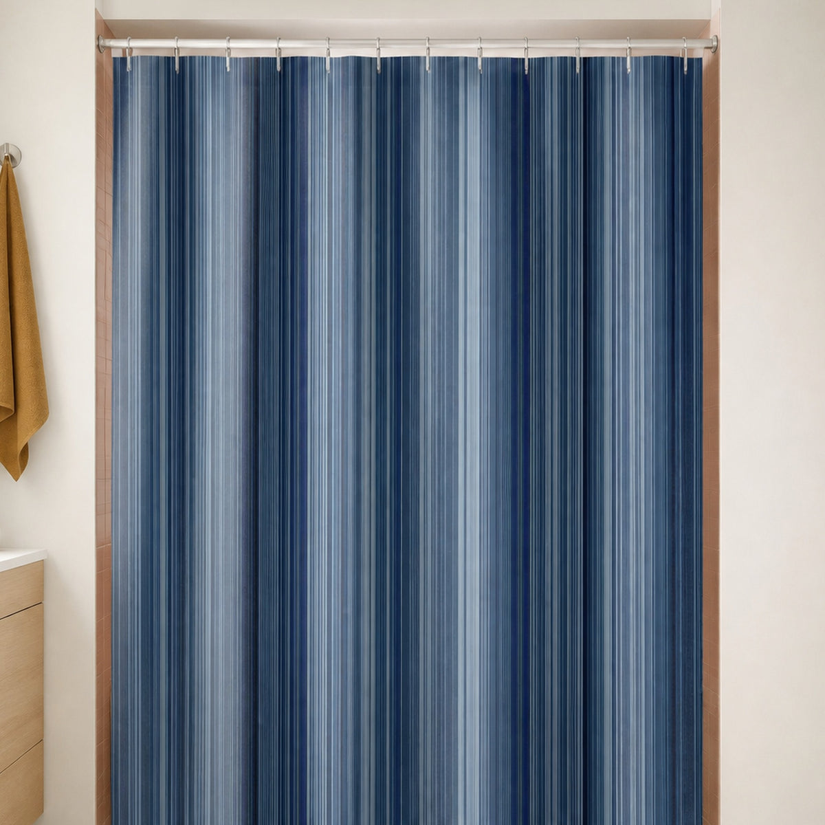 Navy slate dense pinstripe shower curtain in a warm white bathroom with clay pink tile