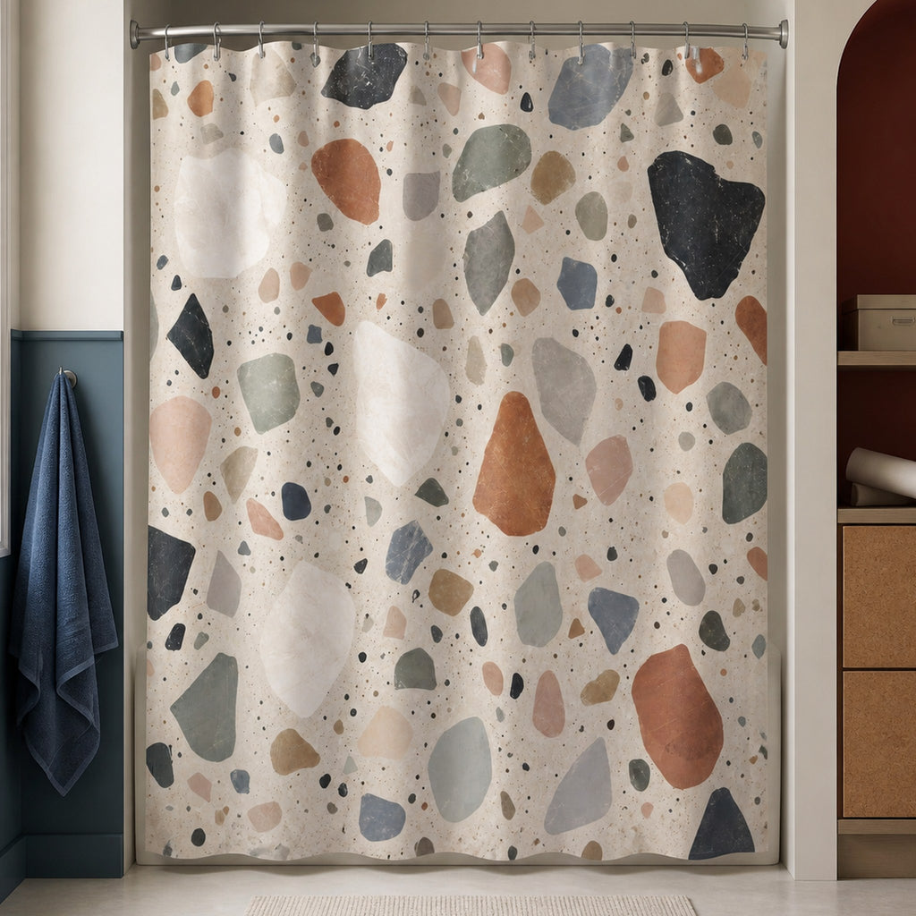 Multicolor stone chip shower curtain in a creative studio bathroom with slate blue walls, oxblood arch and cork storage