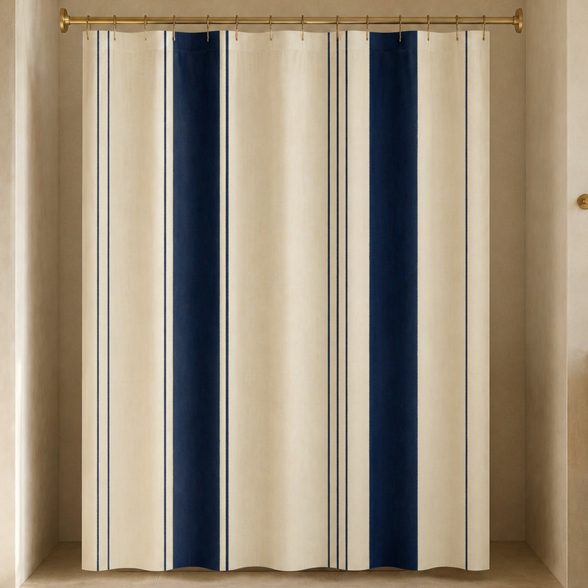 Navy cream pinstripe shower curtain in a luxury bathroom with terracotta stone, mustard cabinetry and brass hardware