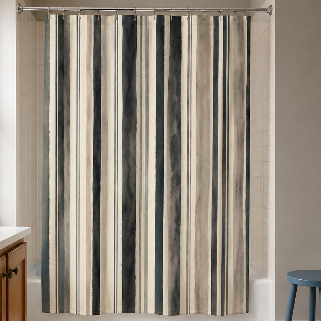 Gray taupe watercolor stripe shower curtain in a warm clay gray bathroom with oak vanity and blue stool