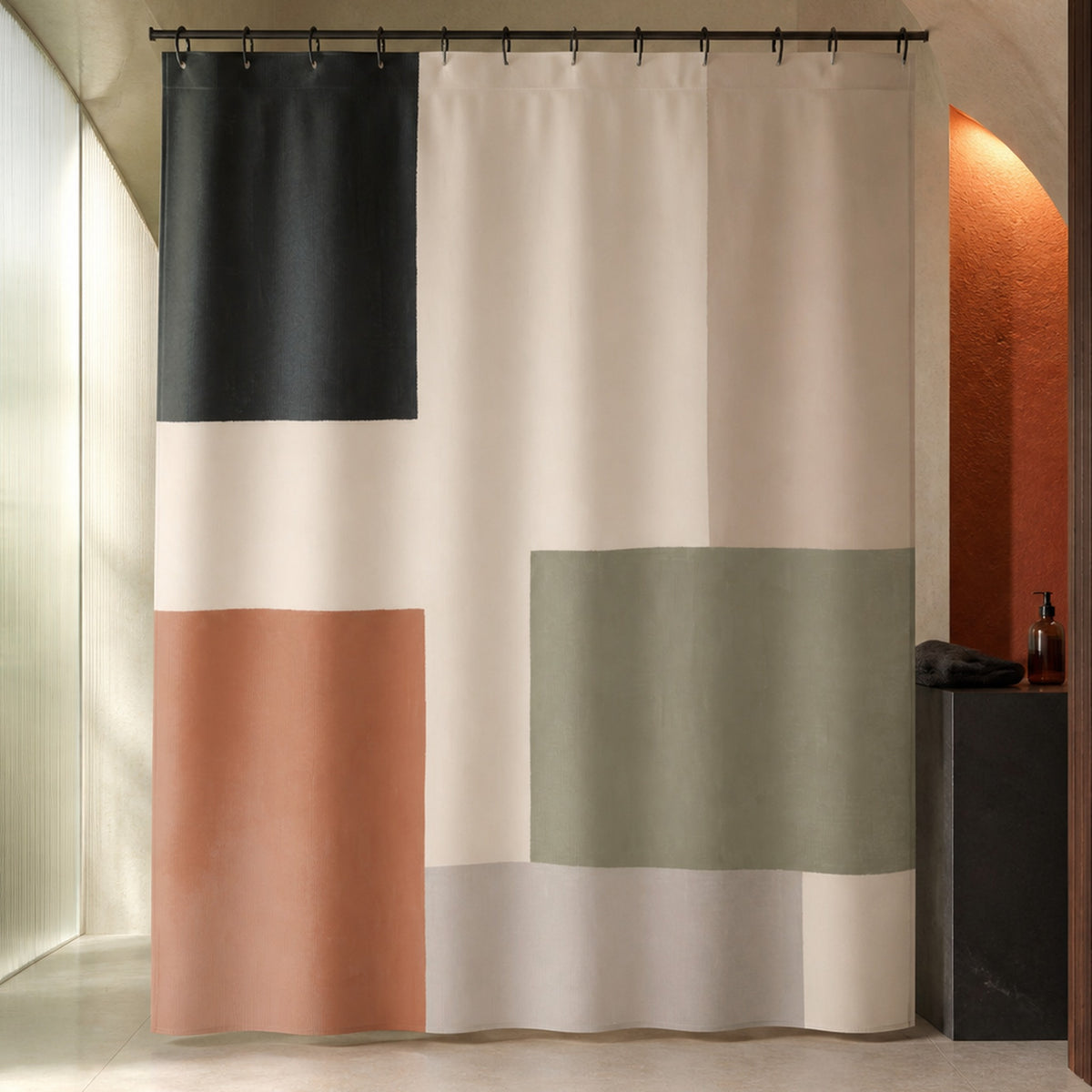 Sage terracotta color block shower curtain in a luxury limestone bathroom with sage glass and terracotta light