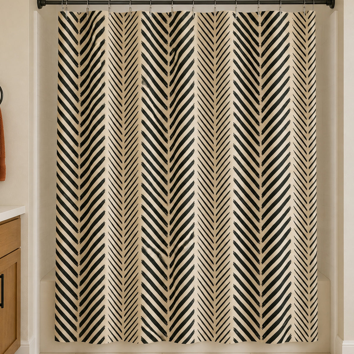 Black cream chevron shower curtain in a warm white guest bathroom with oak vanity and rust towel