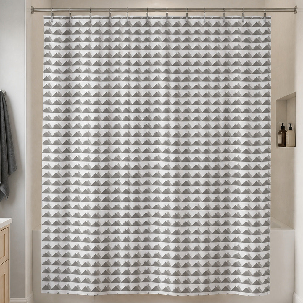 Scandinavian grey mountain shower curtain in a soft grey guest bathroom with pale birch vanity