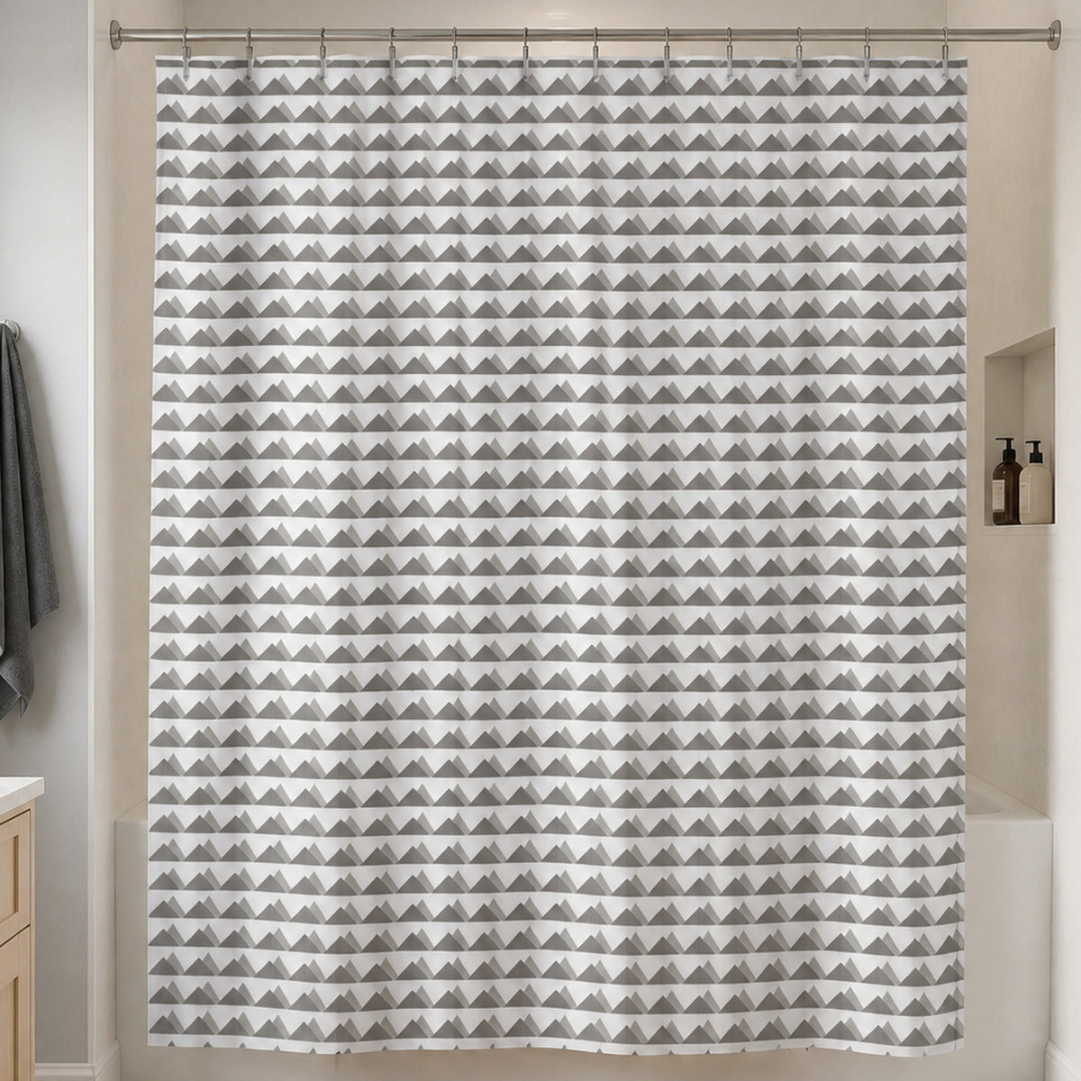 Scandinavian grey mountain shower curtain in a soft grey guest bathroom with pale birch vanity