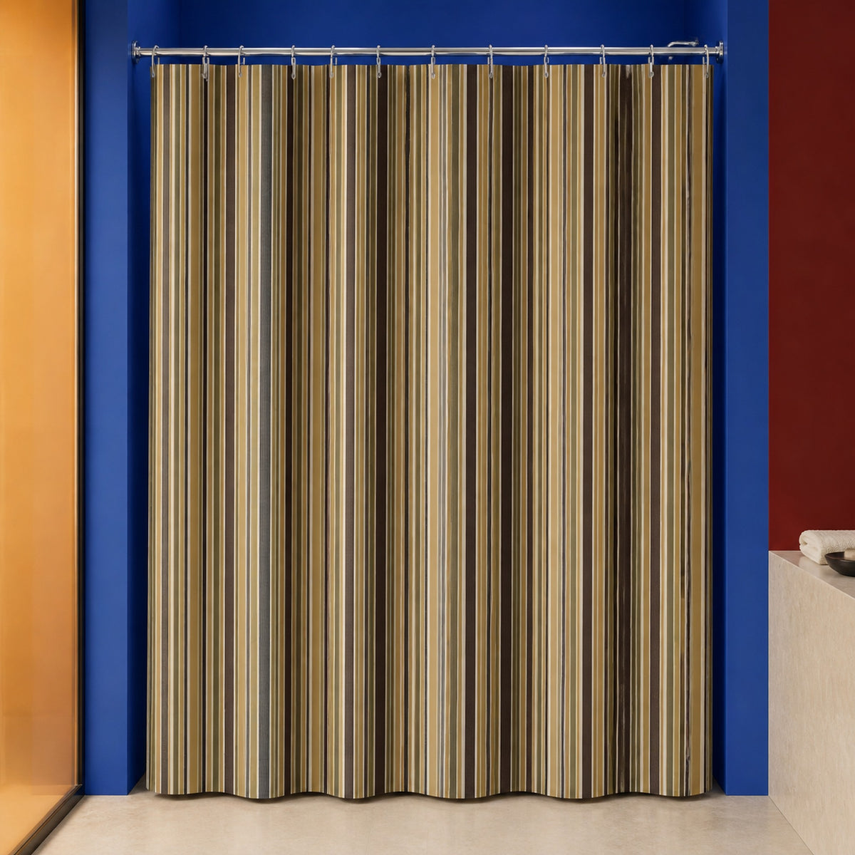 Brown earth tone stripe shower curtain in a cobalt designer bathroom with apricot glass