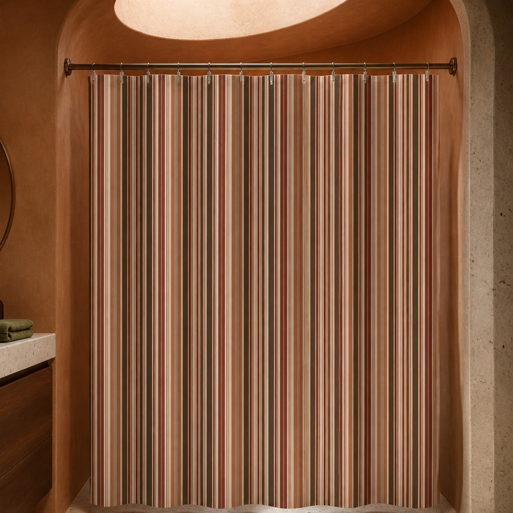 Rust terracotta brown stripe shower curtain in a luxury coral plaster bathroom with oval skylight