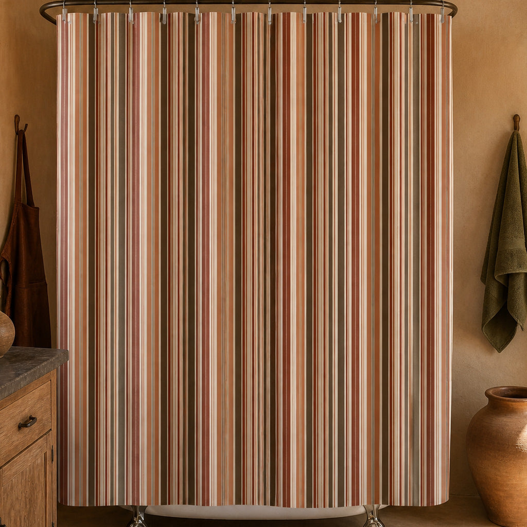 Rust terracotta brown stripe shower curtain in a desert ceramicist washroom with adobe plaster and pottery