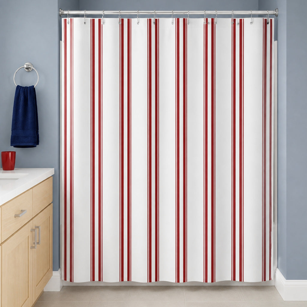 White and red vertical stripe shower curtain in a smoke blue guest bathroom with light birch vanity