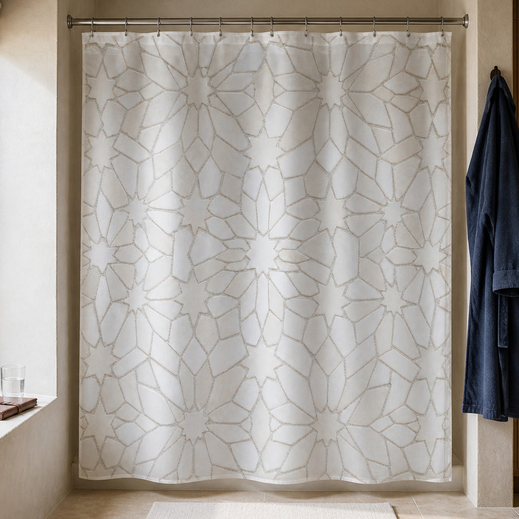 White Moroccan star tile shower curtain in a travel editor bathroom with cedar cabinet and indigo robe